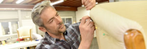 Upholsterer working on commercial furniture, Grand Rapids, MI